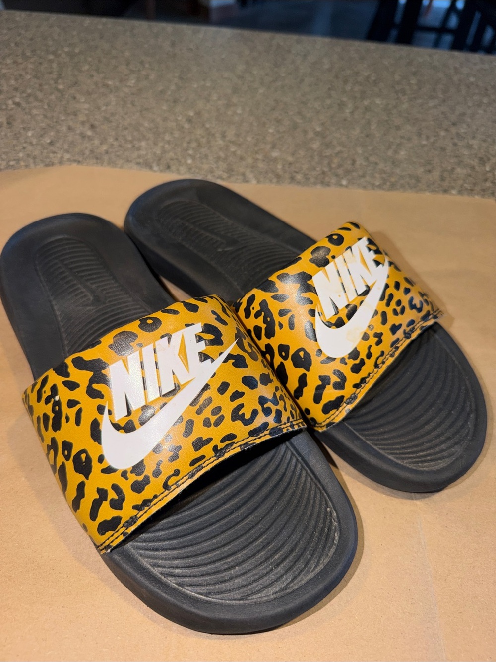 Nike Leopard Print Slide Sandals with White Logo